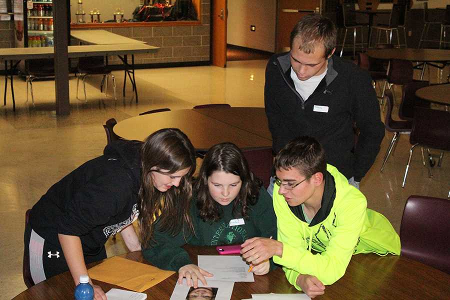 Figuring out who stole the painting, Hannah Wenger (10), Karley VanTheemschee (10), Austin Pettlon (12), and Nolan Monaghan (11) compete as team Chuck y Queso in the Mystery Mayhem Competition.