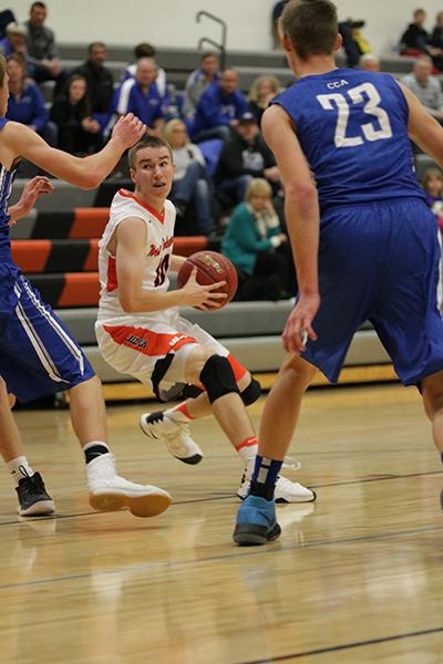 Senior Kyle Wright reads the defense while he powers into the lane. Wright averages 4.5 points per game. 