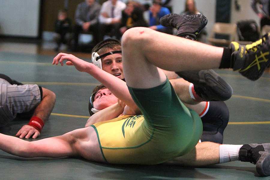 Mitchel Mangold (145) fights for a pin during the dual meet against Beckman last Thursday. Photo by Janette Voss.