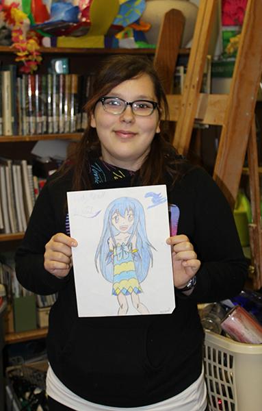 Sophmore Rebecca Cole presents her drawing of Anime character Juvia Lockser from her favorite Anime series “Fairy Tale”.