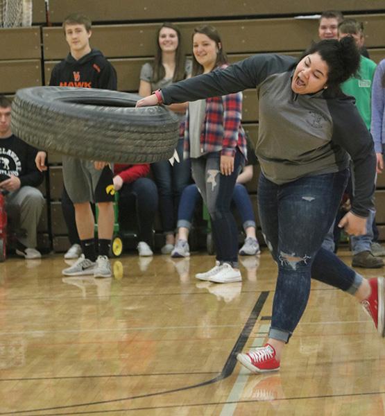 During Ag Olympics, sophomore Adaja Collins throws the tire the farthest, winning the competition. 