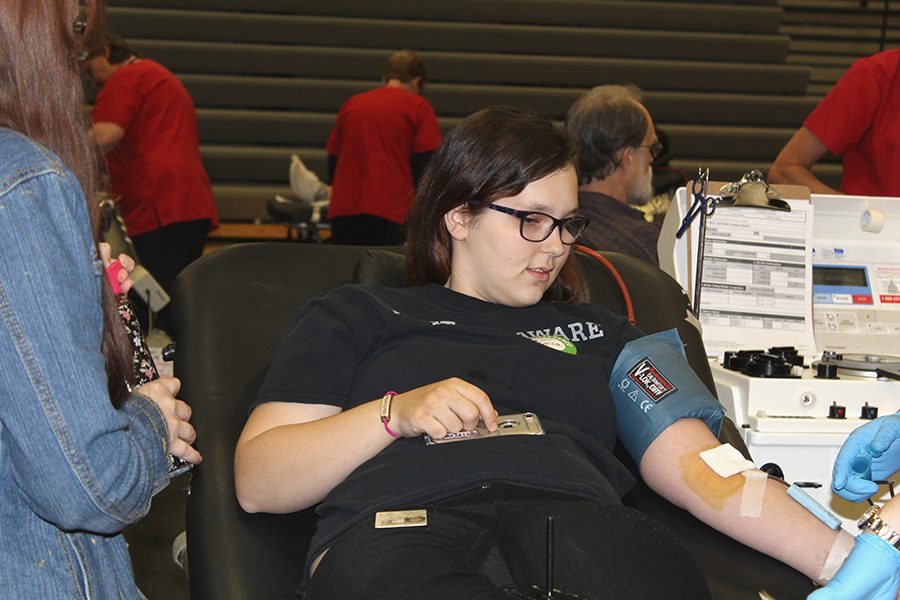 Rebecca Cole (10) watches as her blood is being drawn. During the blood drive, participants donated 59 units of blood. 