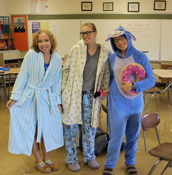 Juniors Grace Reiss, Amber Cook, and Olivia Neuzil start off homecoming week by dressing up for pajama day.