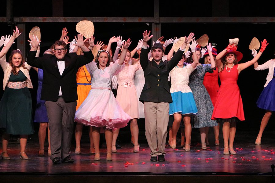 The musical cast comes together to sing the song “Burning Love” at the end of the musical. 
