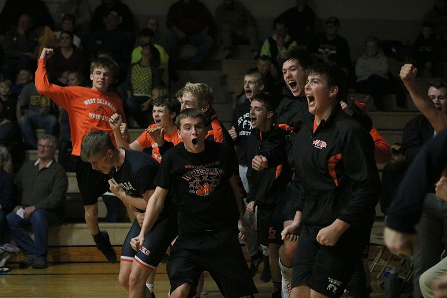 Celebrating after the final match, the Hawks win their first dual of the season. Five out of the seven West Delaware wrestlers, who won throughout the night, ended their matches in pins.
