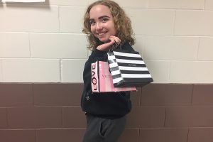 Grace Reiss (11) displays some of her shopping bags from Black Friday weekend.