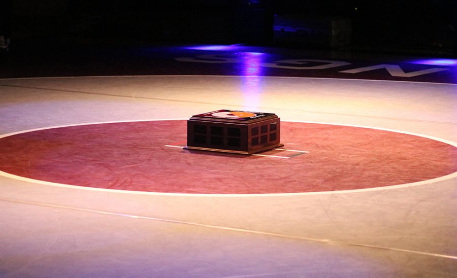 The Team Trophy was displayed under the spotlight, in the center of the mat before the dual begun.