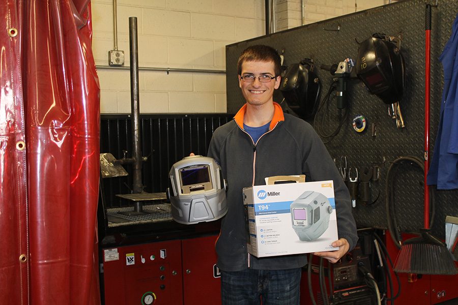 Andrew Buelow wins a new welding helmet for finishing second place at the Kirkwood Welding competition. 