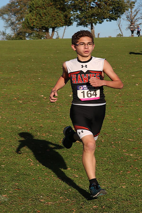 At the state qualifier meet in Manchester, Andrew Salas (10)  finishes with a time of 19:44. 