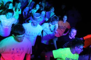 As the Loras students play music, students dance the Macarena. 