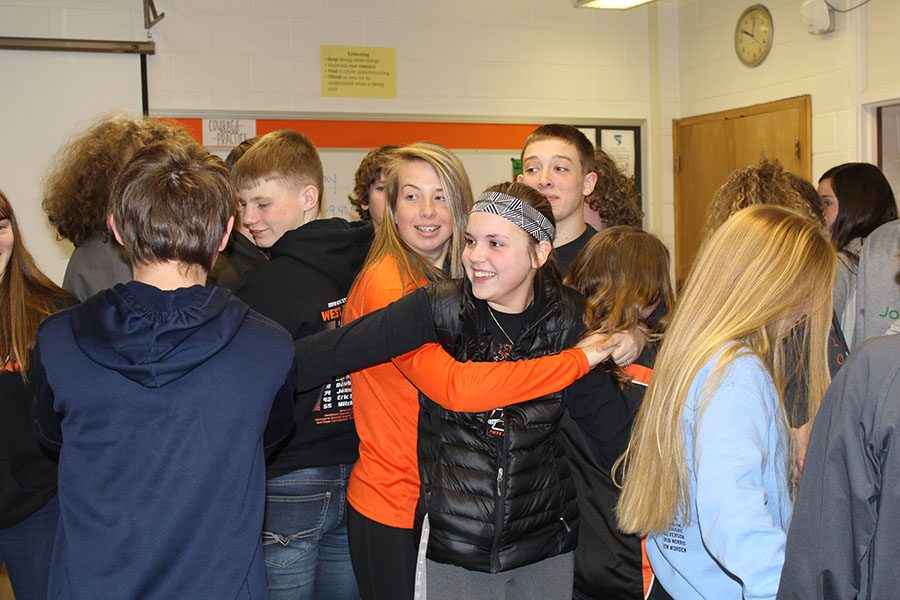 Payton Lewin, Carlee Smith, Jenna Philipp, Jadyn Peyton and other students get tangled in a human knot after taking the reading ISASP test.