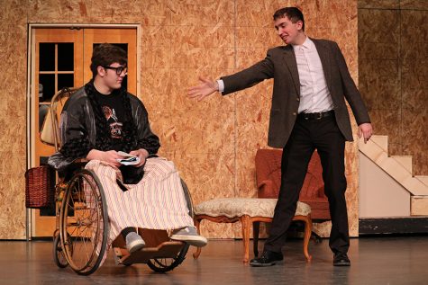 Acting as Burt Jefferson, senior Ethan Opitz asks to shake senior Parker Ostrander’s hand. Ostrander plays radio host Sheridan Whiteside, one of the lead roles in “The Man Who Came To Dinner.”
