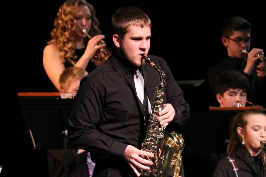 At Swing into Spring, junior Jacob Vaske plays the saxophone. 