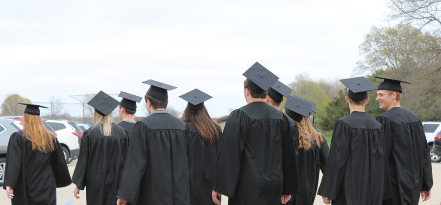 A group of seniors walk to the elementary and middle school for the senior walk.