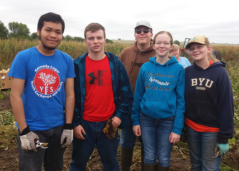 Five students volunteer to pick squash and watermelons: Angga Putra (12), Zach ORear (9), James Nachtman (11),  Alicia Nachtman (10), and Lauren Johnson (9).