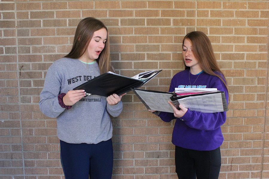 Anna Werner (11) and Kaleah Carter (12) sing through Unclouded Day, one of the five All State pieces.