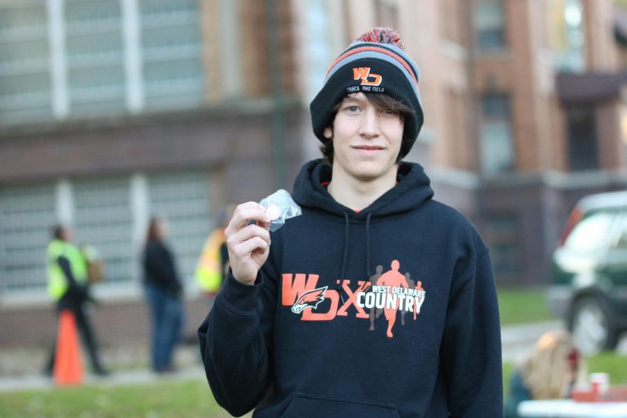 Nathan Goranson (12) smiles with pride after qualifying for the state cross country meet.