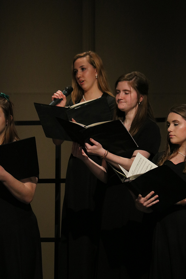  Harper Blommers (9), right, and Denise Cherry (12) perform near Kirsten Stiefel (12) as she solos in Go Tell it on the Mountain. Additional soloists included Rebecca Farmer (11) in the same song, and Kamira Zehr (9), Alicia Nachtman (10) and Denise Cherry (12) in O Holy Night.