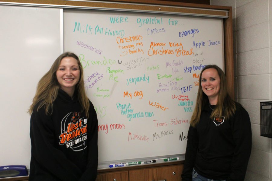 Teachers Jennie Voss and Melissa Hauschild show off Voss’ grateful board.