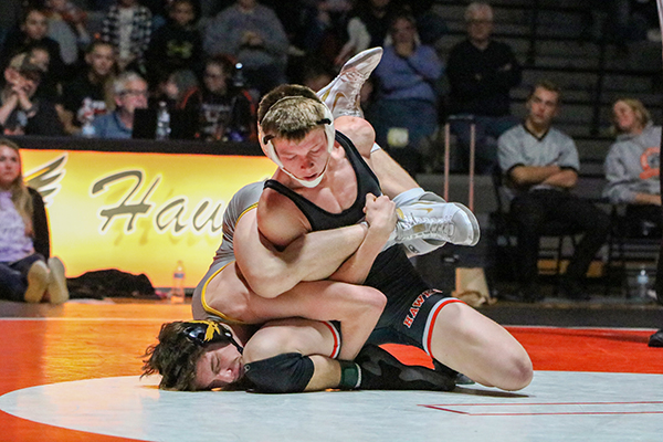 Freshman Logan Peyton works to gain an escape against the Go-Hawks 138-pounder. Peyton won his match by technical fall, 20-6.