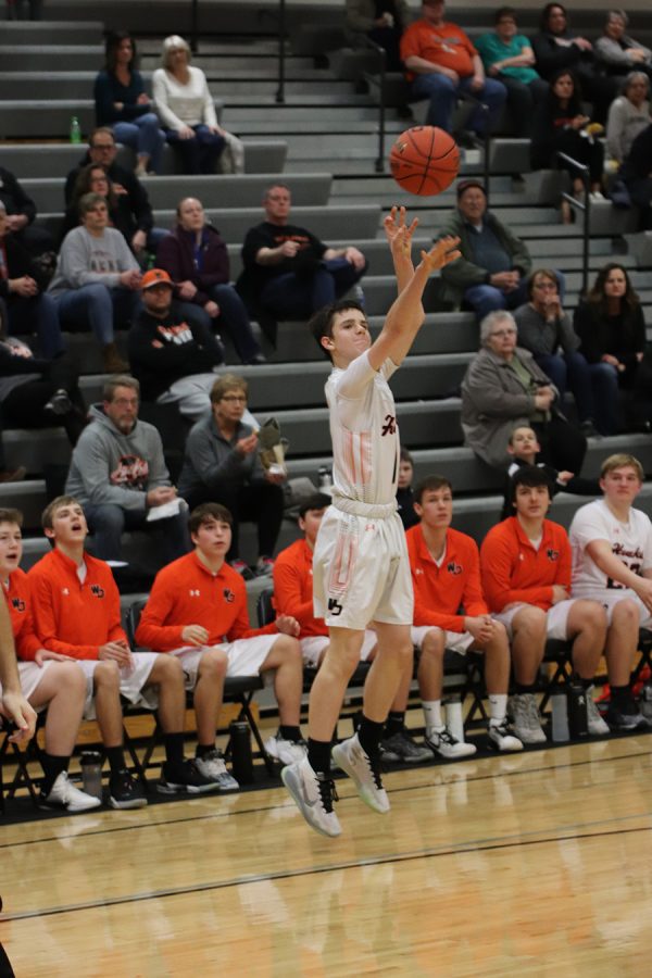 Blake DeMoss (10) takes a shot at the hoop to help his team get ahead. DeMoss scored six points, with two three-pointers in the third quarter.