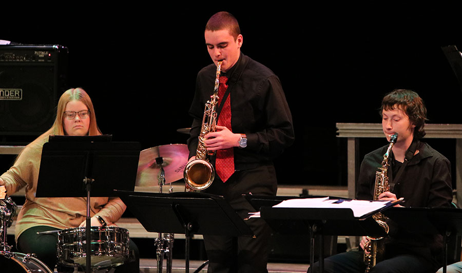 Natalie Kehrli, Jacob Wenger, and Tanner Kelchen play in Jazz Band I at Swing into Spring. 
