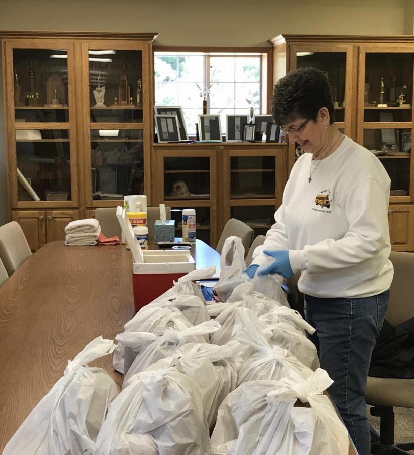 Shirley Mangold packs grab-n-go lunches at the Greeley Fire Station. The last week of April, 530 meals were distributed at this location. 