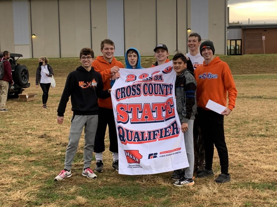 The West Delaware Boys Cross Country Team qualifies for a spot at the state meet for the first time since 1985. Finishing second behind Solon, seniors Andrew Salas, Cael Meyer, Blake Smith, Tyger Vaske, Robinson Martinez Junech, Mathew Mensen, and Staveley Maury celebrate their successful meet with a picture of their state qualifying banner.  