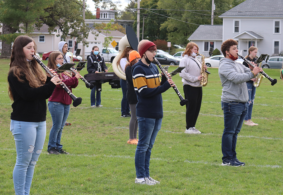 Practicing their show The Beatles, the band rehearses with their new bell covers. The covers were purchased to slow the spread of the virus.