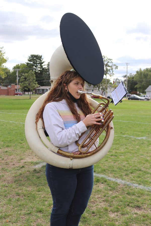 With the new bell cover on her instrument, Samantha Anderson (11) rehearses alongside the rest of the band for an upcoming performance.