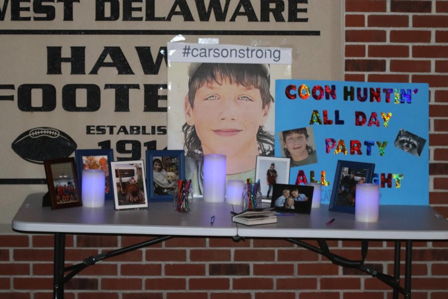 Students create a display to honor freshman Carson Crane at the Oct. 16 football game.
