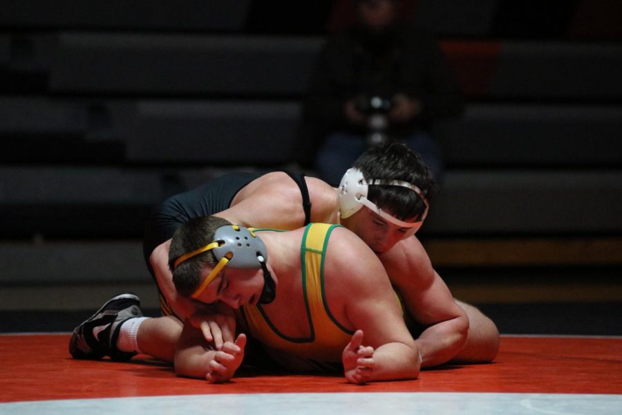 Junior Wyatt Voelker attempts to pin his opponent during the home wrestling meet on Dec. 17. West Delaware wrestled Beckman Catholic and Mount Vernon, dominating Beckman Catholic, 62-12, and Mount Vernon, 42-3.