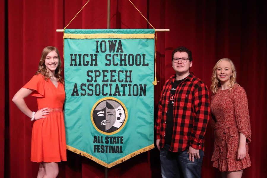 Individual All-State Speech Nominees Addie Reetz, Laiken Blommers and Jadyn Werner pose with the All State Speech banner.