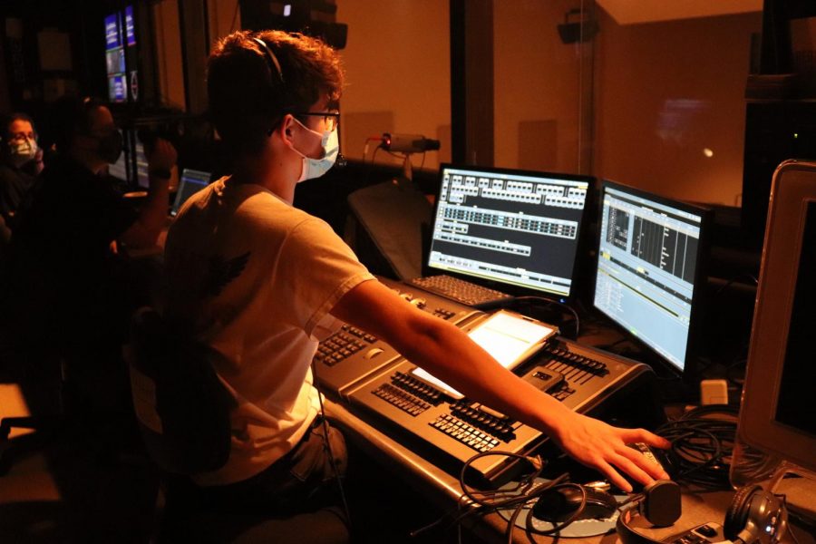 Andrew Salas (12) runs the lighting for the show. 