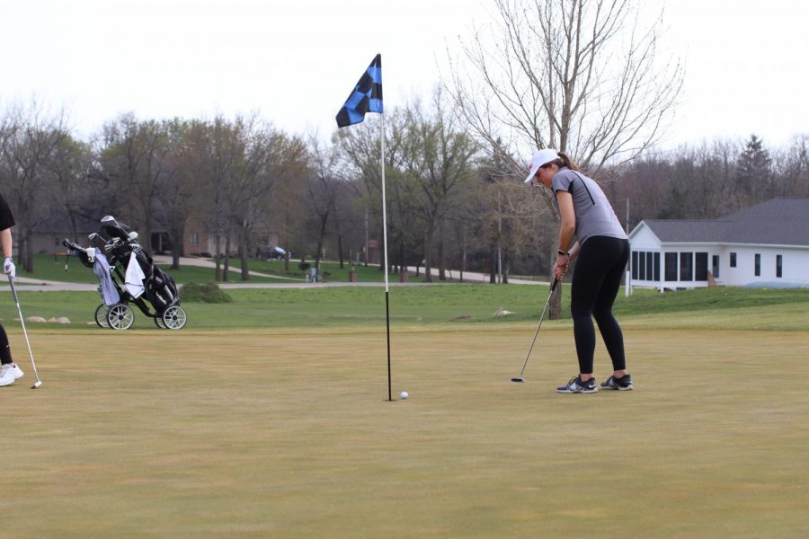 Morgan Collier rolls a putt at the West Delaware invitation on April 26. 