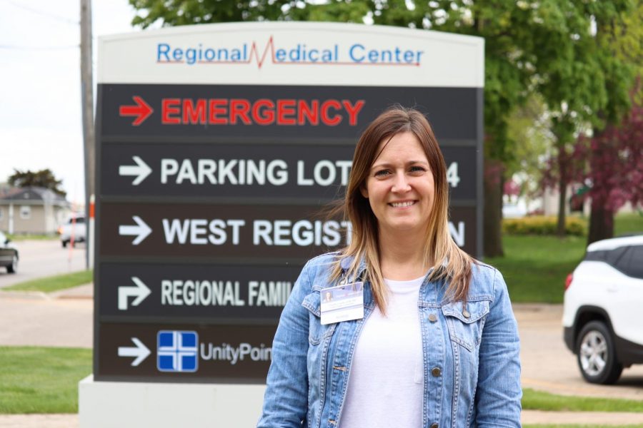 Charity Loecke, Delaware County Public Health nurse, stands in front of the Regional Medical Center.