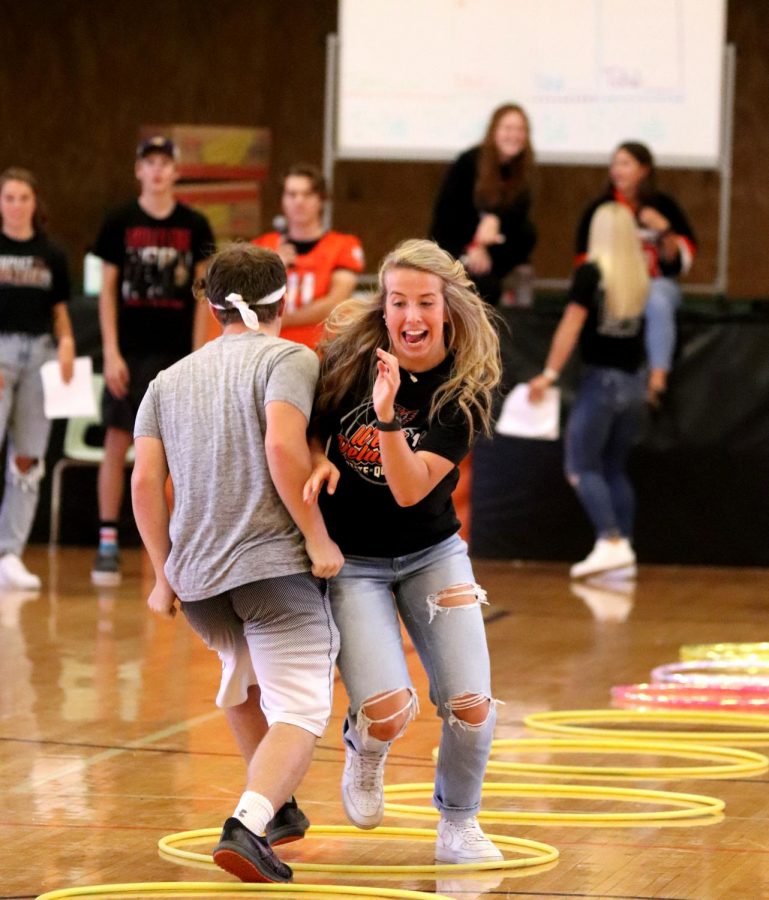 In pursuit of victory during the Homecoming Olympics, senior Carlee Smith beats her opponent in rock paper scissors. Smith won the game for the seniors, which gained points for their overall victory.
