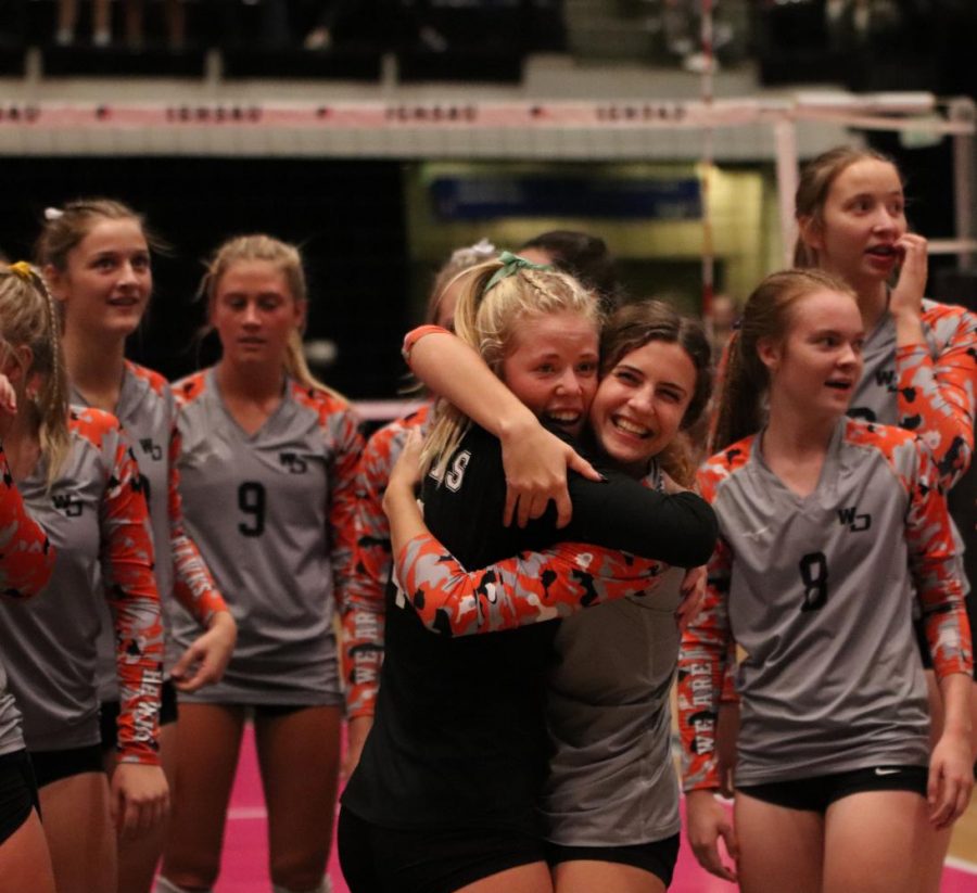 Seniors Ella Koloc and Juliette Weber embrace each other after West Delaware beats Sergeant Bluff-Luton in the state volleyball semifinal match. 