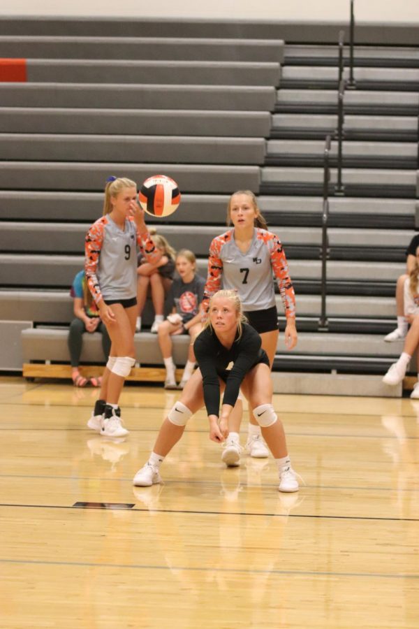 During warm ups against Marion on Sept. 7, Ella Koloc (12) prepares to pass a ball. 