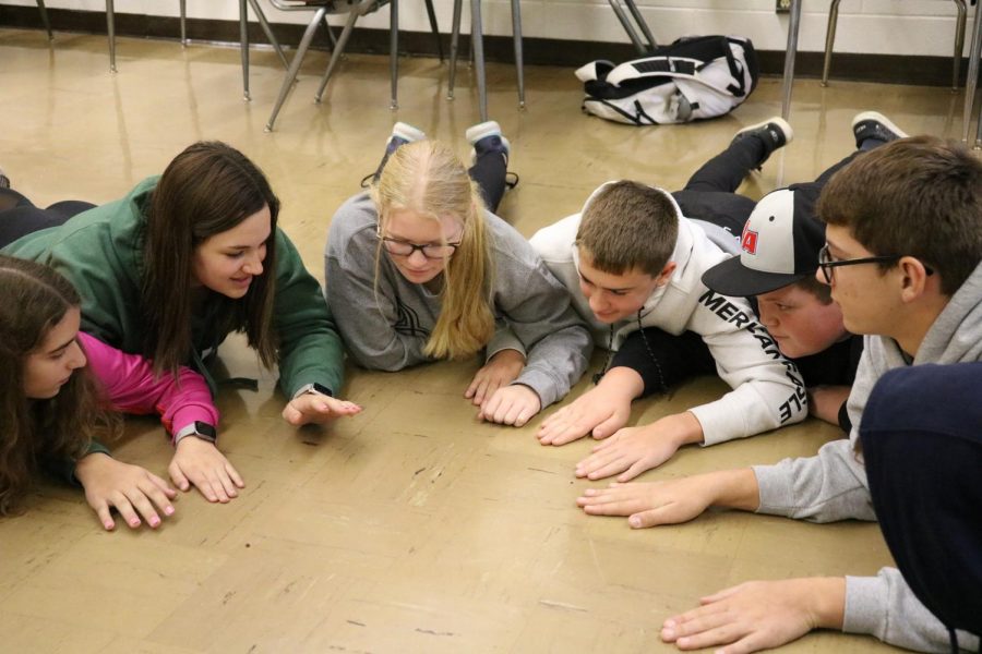 A freshman homeroom class participates in a Ricochet activity.