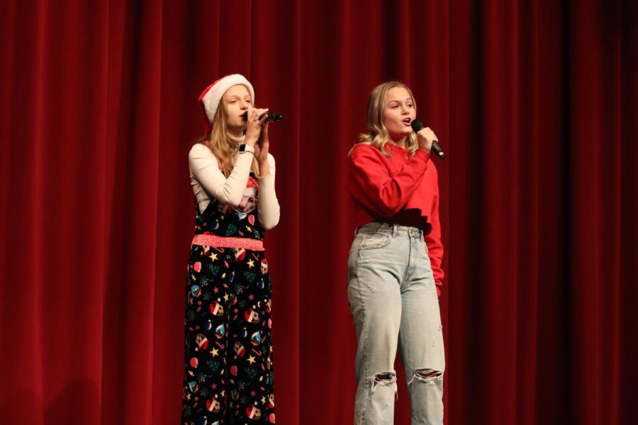 Maggie Millenkamp (10) and Grace Millenkamp (12) perform Have Yourself a Merry Little Christmas in the auditorium.