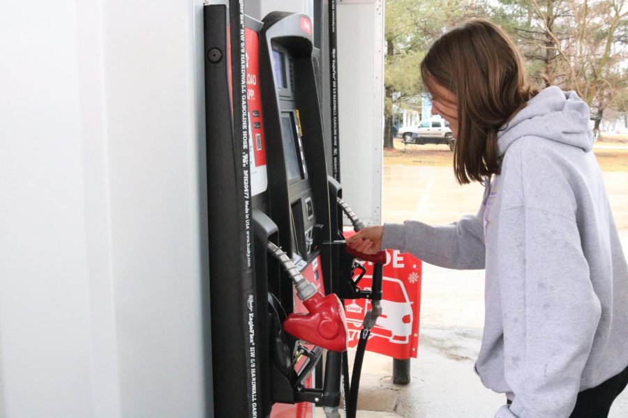Junior Faith Rich prepares to pay for gas at the north-end Caseys in Manchester.