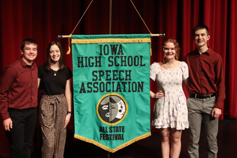 Caleb Stocks (9), Stephanie La Rosa (10), Lexie Rieken (12) and Evan Kartman (10) pose with the All-State banner after being nominated to perform at Individual All-State.