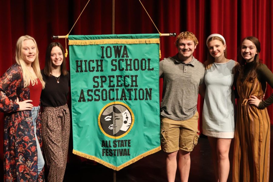 Chloe Bahls (12), Stephanie La Rosa (10), Aiden Lee (12), Makayla Gasper (12) and Isabella Kanellis (12) smile as they pose with the All-State group banner. 