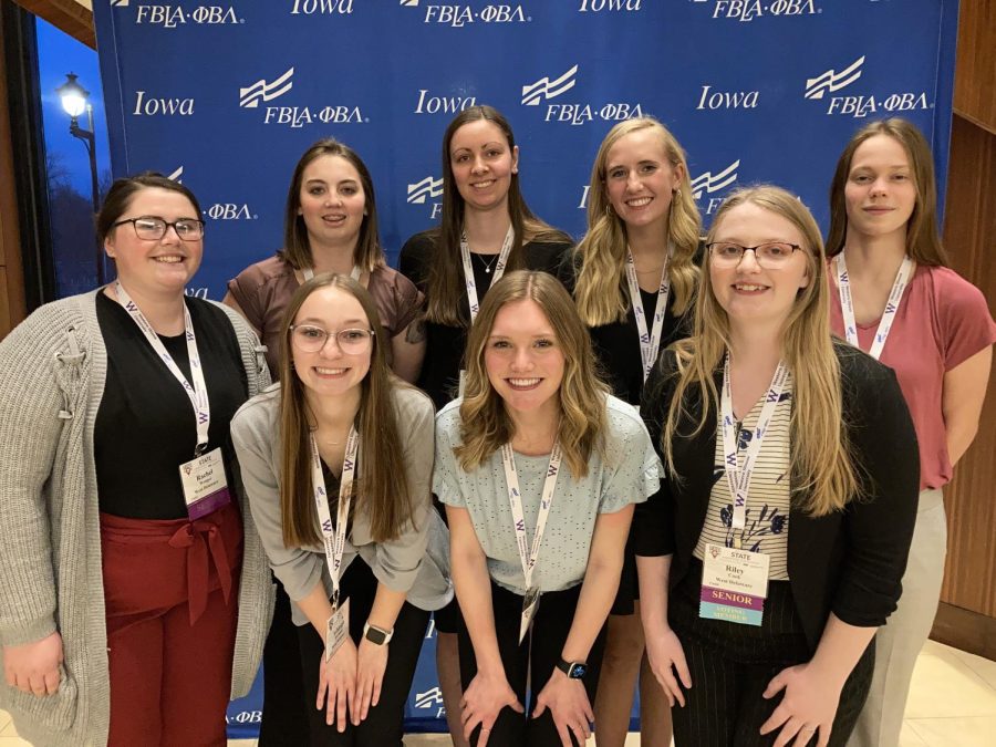 Eight students smile in front of the state FBLA sign at the convention. 
Front Row: Ashleigh Hartman, Maddie Hoeger, Riley Cook; Back Row: Rachel Wenger, Allison Mullen, Alison Deutmeyer, Kennedy Klostermann, and Anastasia White.  