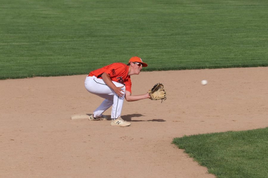 Griffen Lot (9) catches the ball at second base to get another out for the Hawks.