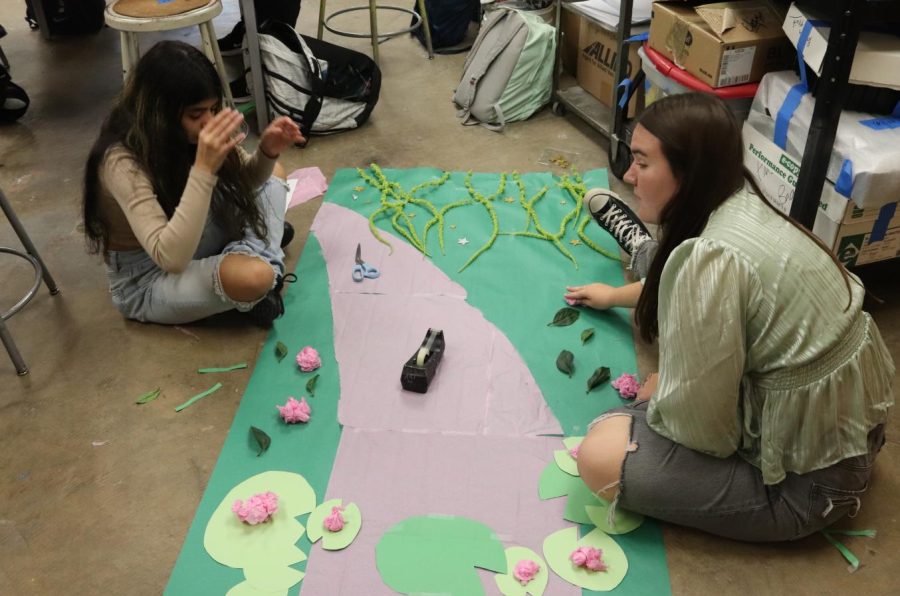 Creating a background for door decorating fell to Melanie Osorio Rodriguez (11) and Eadie Tibbott (11). They created a lily pad background for their door theme, which was the “Princess and the Frog.” 