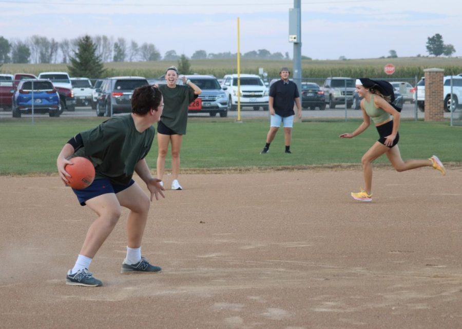 During the Homecoming Powderpuff kickball game, senior Cameron Geuther prepares to deliver a throw to first base. Geuther led his team to victory, 9-8, but due to bad weather, the tournament was cut short.
