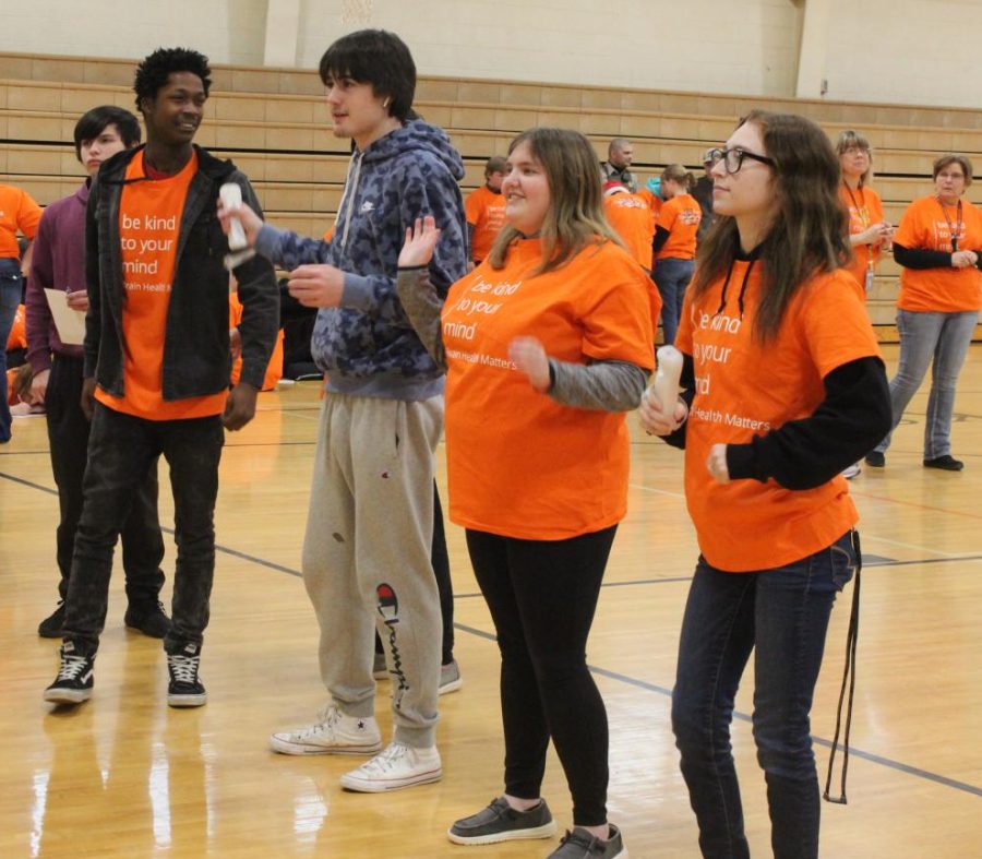 Juniors and Seniors Cameron Mcgee (11) Anthony Withey (11) Delaney Holtz (12) and Harmony Wheaton (12) dancing together during the Mental Health activities