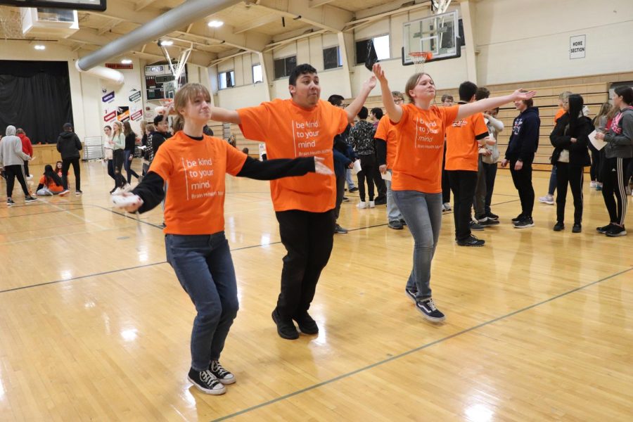 Seniors Olivia Zirtzman, Saul Hernandez and Lauren Johnson play Just Dance in the Upper Gym during Be Kind To Your Mind day. 